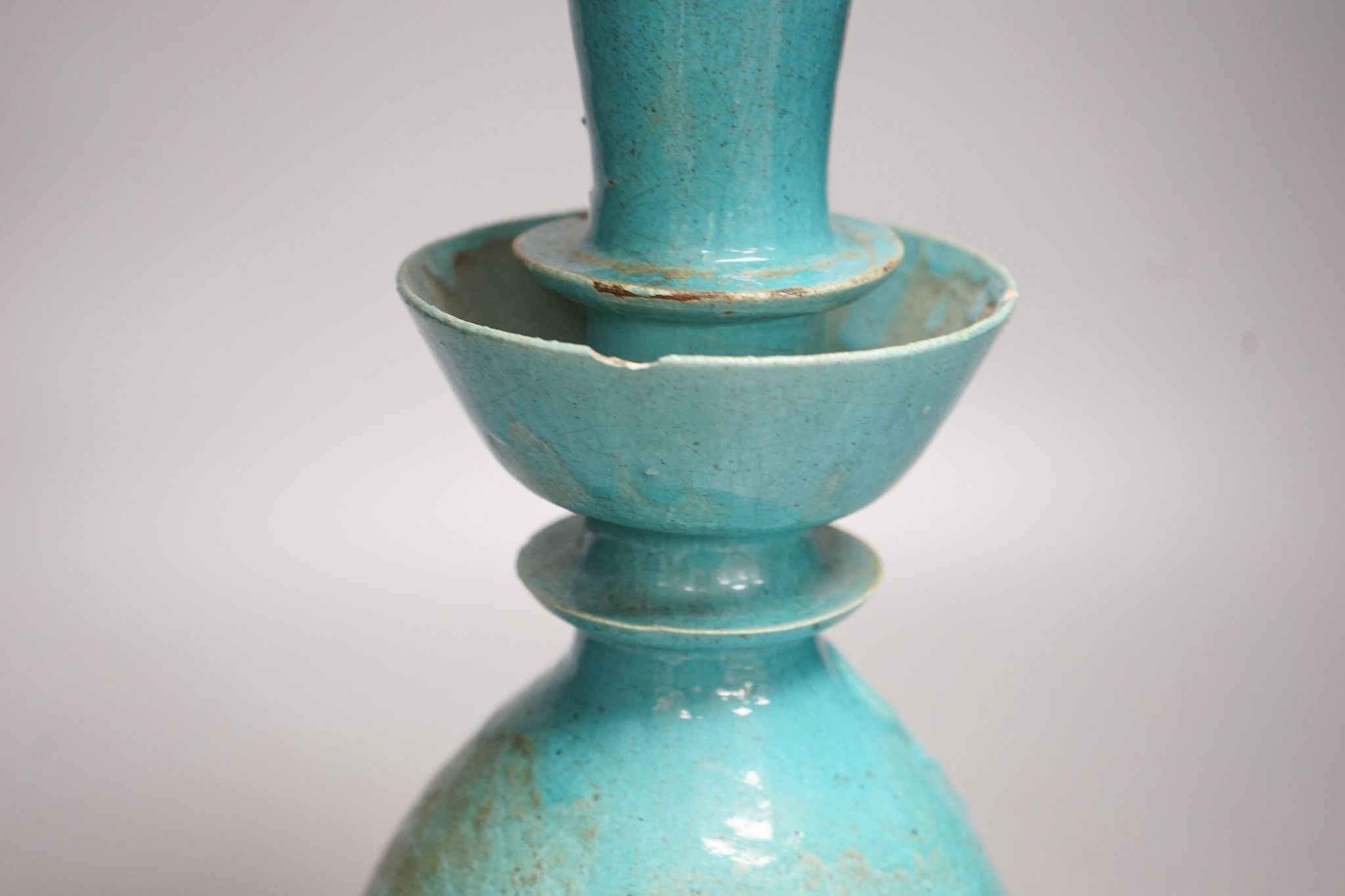 A Persian turquoise glazed huqqa base, 17th century or later, 33cm